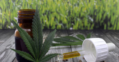 cannabidiol | Prader-Willi Syndrome News | Clinical Trials | Photo of marijuana leaves next to a dropper