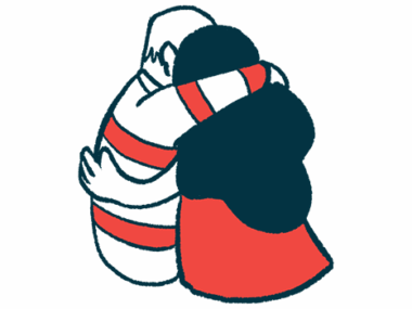 Two people share a hug.