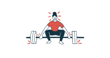 A person strains to lift a set of barbells.