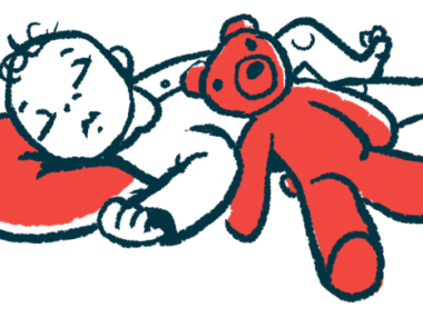 An infant sleeps with their head on a red pillow while a red teddy bear rests on their stomach.