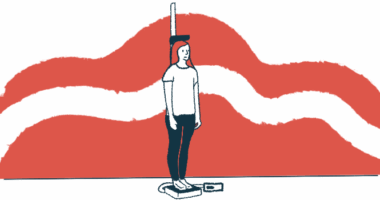 A young woman stands on a scale that measures her height.