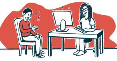 A patients sits while speaking to a doctor, who is taking notes on a computer.