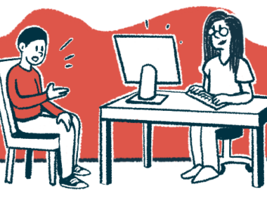 A patients sits while speaking to a doctor, who is taking notes on a computer.